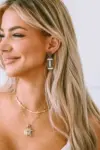 Brown Glittering Football Pendant Earrings